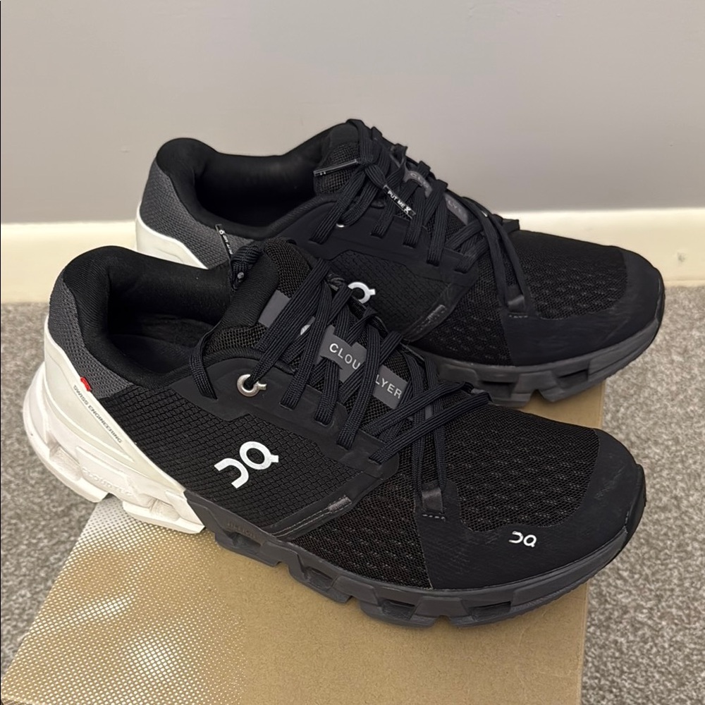 On Running Black and White Athletic Shoes with CloudTec Cushioning